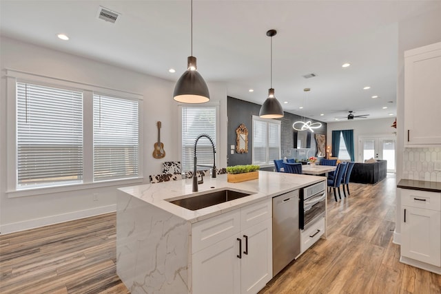 508 E 31st St, Houston, TX 77018 - kitchen featuring a sink, stainless steel dishwasher, open floor plan, recessed lighting, and a ceiling fan