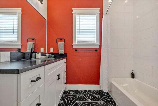 508 E 31st St, Houston, TX 77018 - bathroom with plenty of natural light, tile patterned floors, vanity, and shower / bath combo with shower curtain