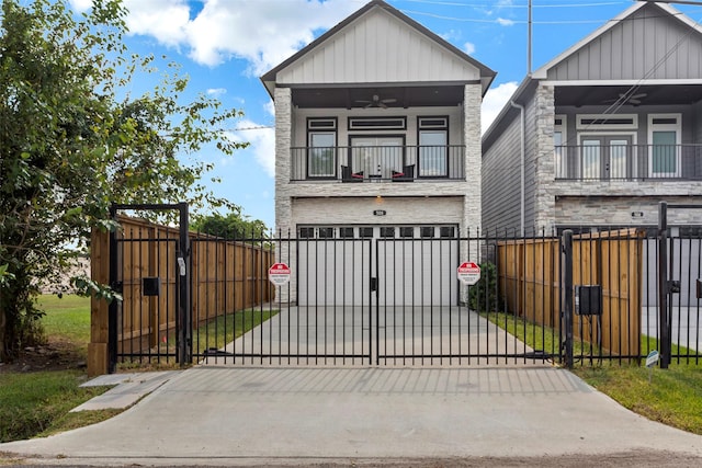 508 E 31st St, Houston, TX 77018 - view of front facade featuring driveway, a garage, ceiling fan, a balcony, and board and batten siding