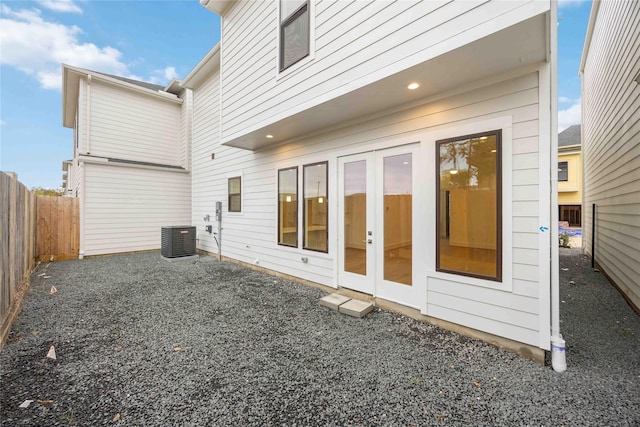 back of house with central AC and a patio