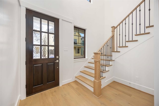 entryway with hardwood / wood-style floors