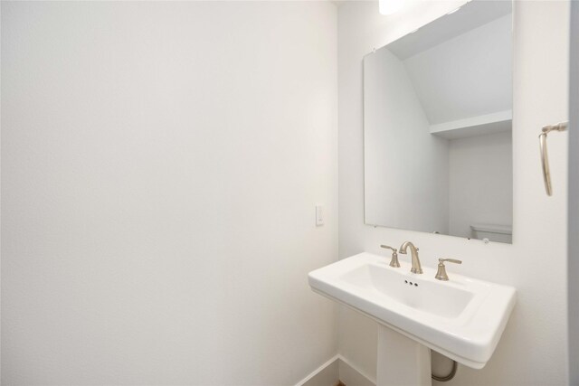 bathroom featuring toilet and sink