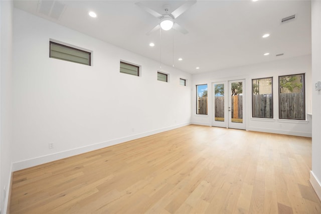 empty room featuring ceiling fan and light hardwood / wood-style flooring