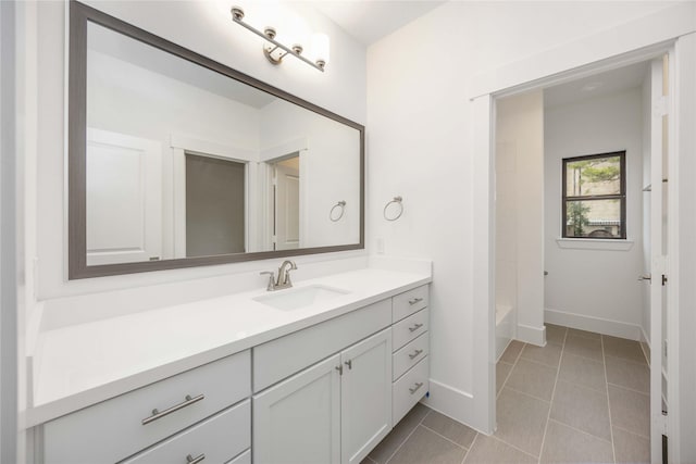 bathroom featuring tile patterned floors, shower / bathing tub combination, and vanity