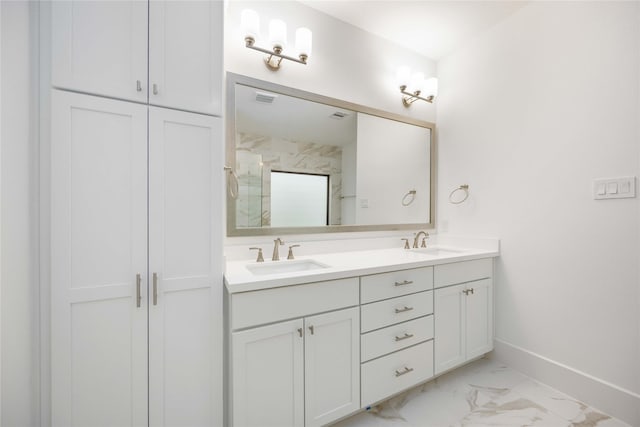 bathroom with vanity and a shower