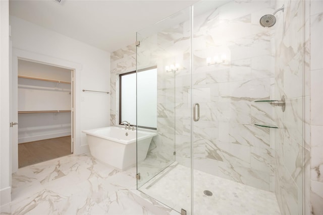 bathroom with shower with separate bathtub