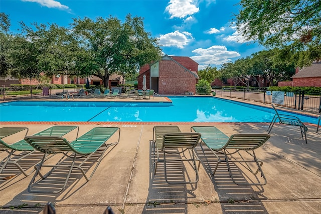 view of swimming pool featuring a patio