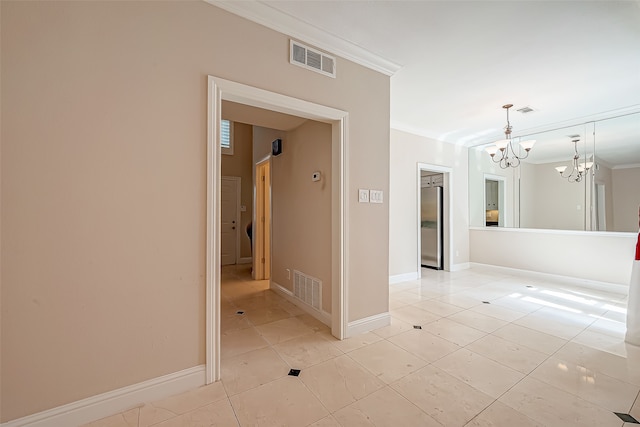 tiled empty room with a notable chandelier and ornamental molding