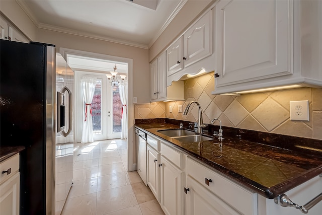 kitchen featuring white cabinetry, stainless steel appliances, sink, and light tile patterned floors