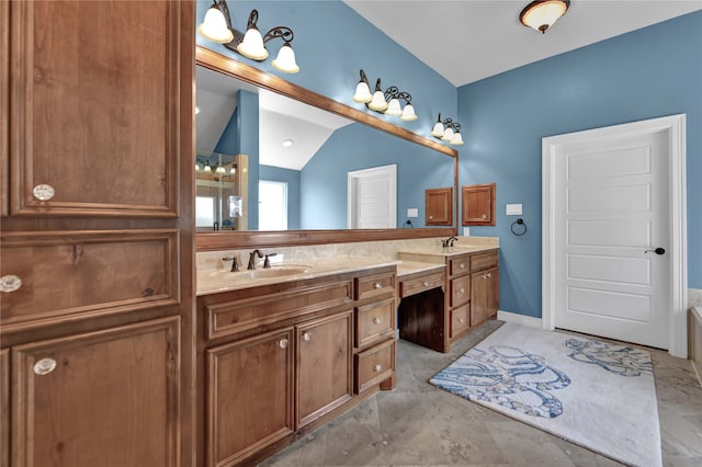 bathroom with vanity and vaulted ceiling