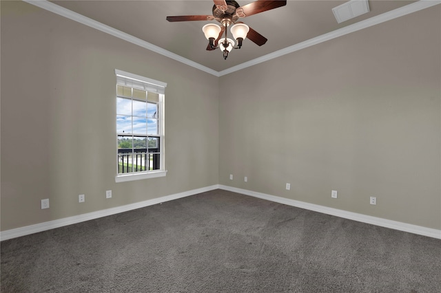 empty room with ornamental molding, carpet, and ceiling fan