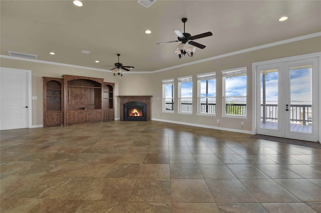 unfurnished living room with ornamental molding, ceiling fan, and french doors