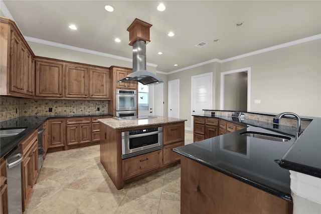 kitchen with appliances with stainless steel finishes, tasteful backsplash, crown molding, a center island, and sink