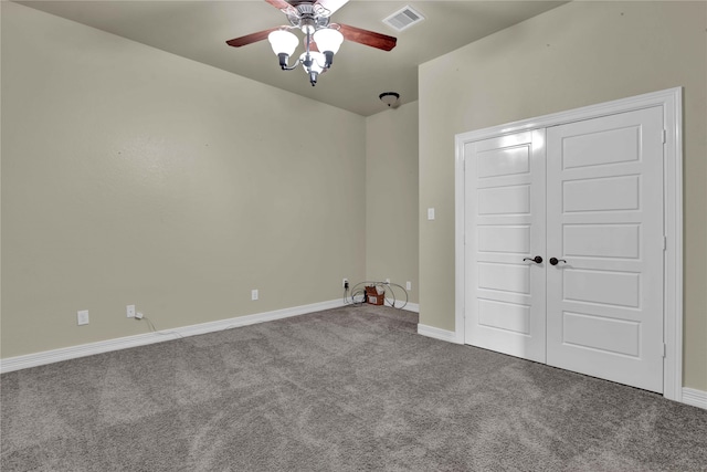 unfurnished bedroom with ceiling fan, a closet, and carpet