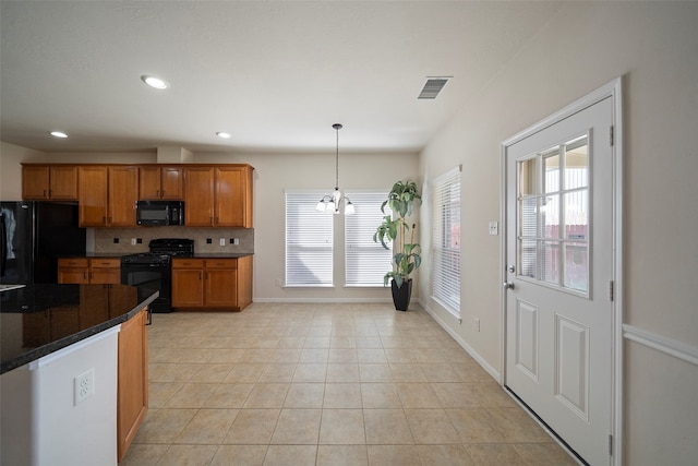 kitchen with black appliances, backsplash, hanging light fixtures, a notable chandelier, and light tile patterned floors