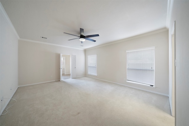 unfurnished room featuring crown molding, light colored carpet, and ceiling fan