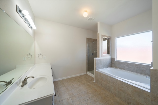 bathroom featuring vanity, tile patterned floors, and independent shower and bath