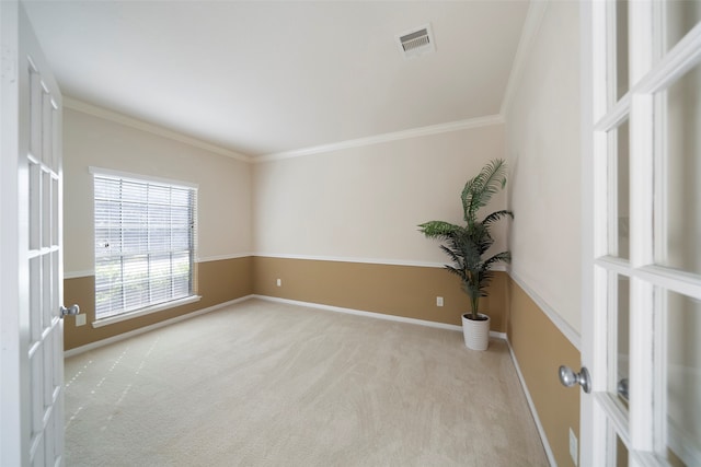 carpeted spare room with crown molding