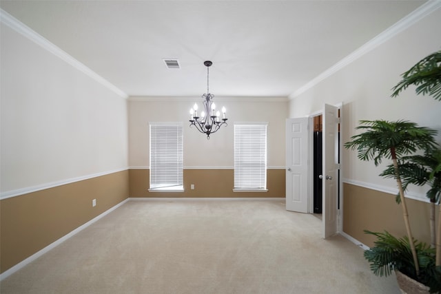 spare room featuring a notable chandelier, crown molding, and light carpet