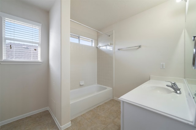 bathroom featuring vanity, tile patterned floors, and tiled shower / bath