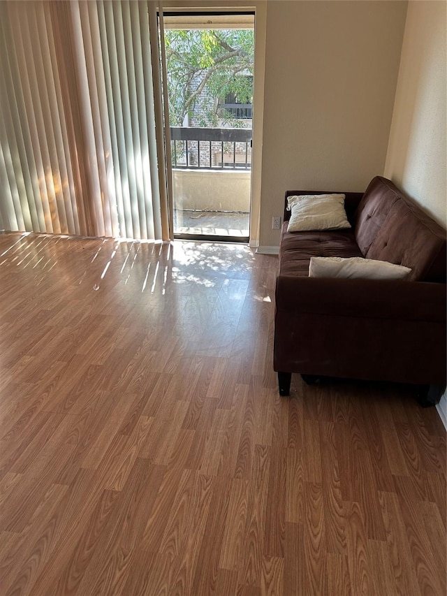 2207 S Braeswood S Unit 42E, Houston, TX 77030 - living room with wood finished floors and baseboards