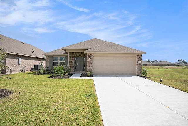 view of front of house with central AC unit, a front yard, and a garage