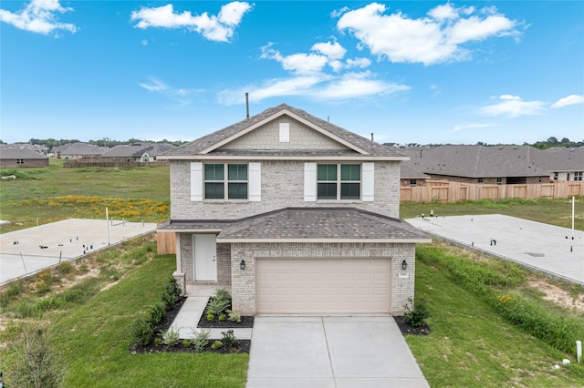 view of front of house with a front lawn and a garage