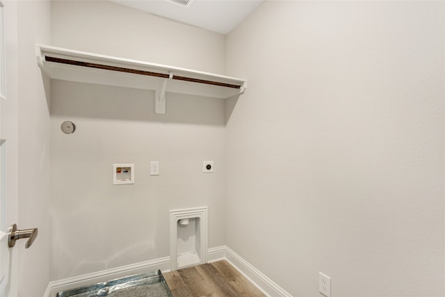 washroom with hookup for a washing machine, hardwood / wood-style floors, and electric dryer hookup