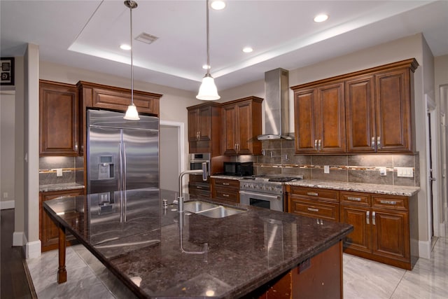 19523 Riverwalk Dr, Porter, TX 77365 - kitchen with wall chimney range hood, a sink, high quality appliances, tasteful backsplash, and decorative light fixtures