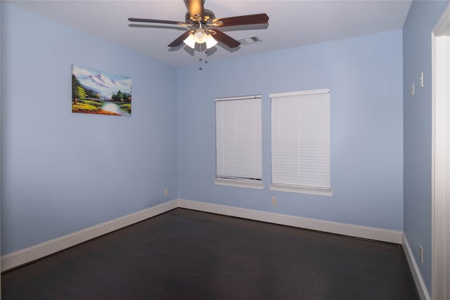 unfurnished room featuring ceiling fan and dark hardwood / wood-style floors