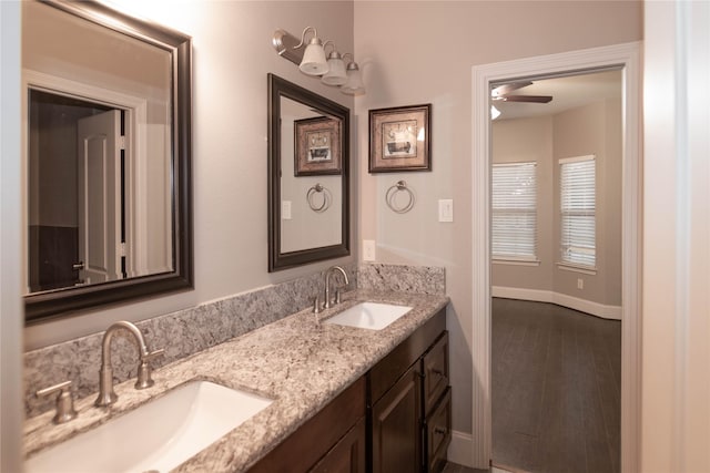 19523 Riverwalk Dr, Porter, TX 77365 - full bath with baseboards, a ceiling fan, double vanity, and wood finished floors