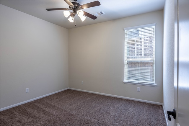 spare room featuring ceiling fan and carpet flooring