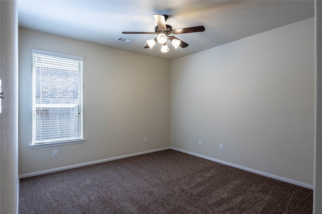 unfurnished room with ceiling fan and carpet flooring