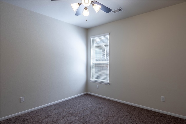 unfurnished room with ceiling fan and carpet floors