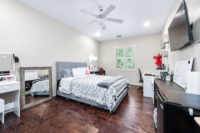 bedroom with ceiling fan and dark hardwood / wood-style flooring