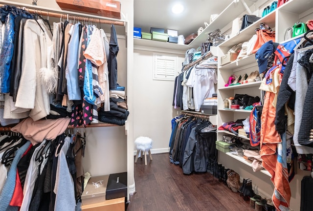 walk in closet featuring dark hardwood / wood-style floors