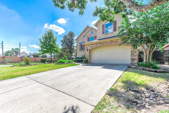 view of front facade featuring a front yard and a garage