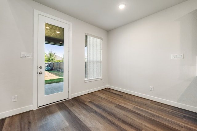 doorway with dark wood-type flooring