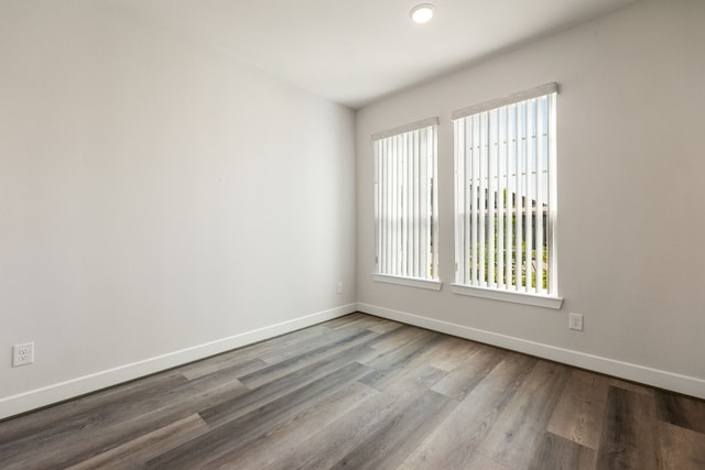 spare room with light hardwood / wood-style flooring