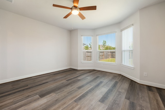 unfurnished room featuring ceiling fan and dark hardwood / wood-style floors