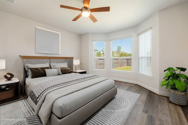 bedroom featuring hardwood / wood-style floors and ceiling fan