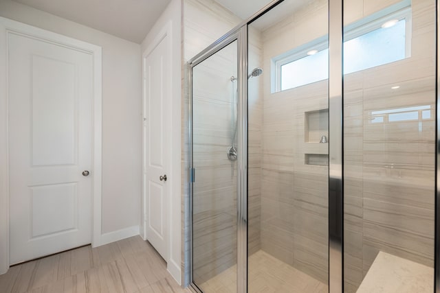 bathroom featuring an enclosed shower