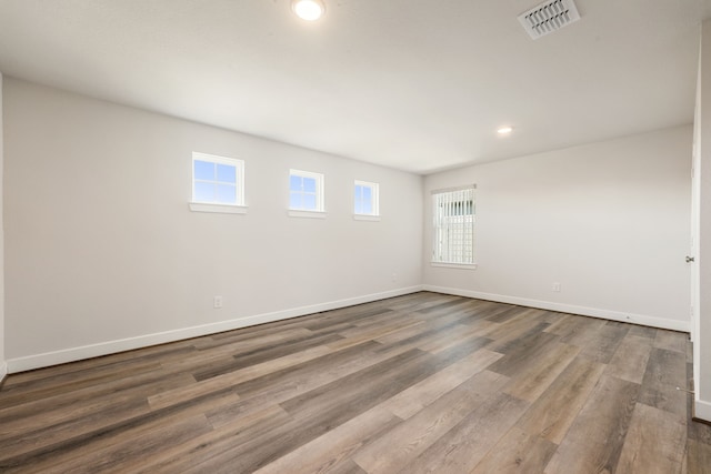 unfurnished room featuring wood-type flooring