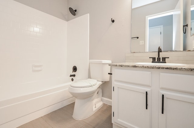 full bathroom with vanity, bathtub / shower combination, and toilet