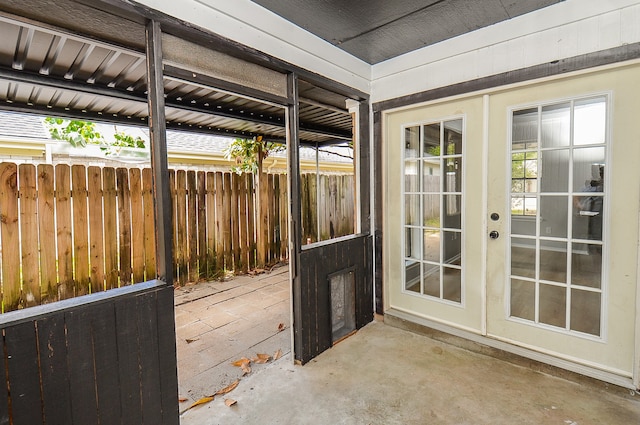 exterior space featuring concrete flooring and french doors