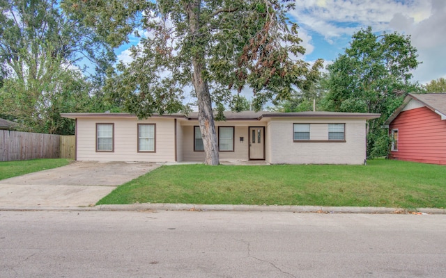 ranch-style home with a front yard