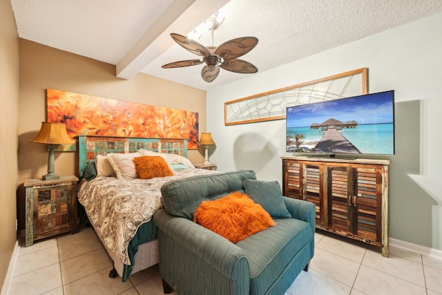 tiled bedroom with ceiling fan, beamed ceiling, and a textured ceiling