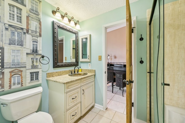 bathroom featuring vanity, a textured ceiling, toilet, and tile patterned floors