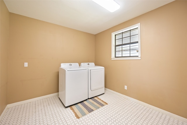 clothes washing area featuring independent washer and dryer