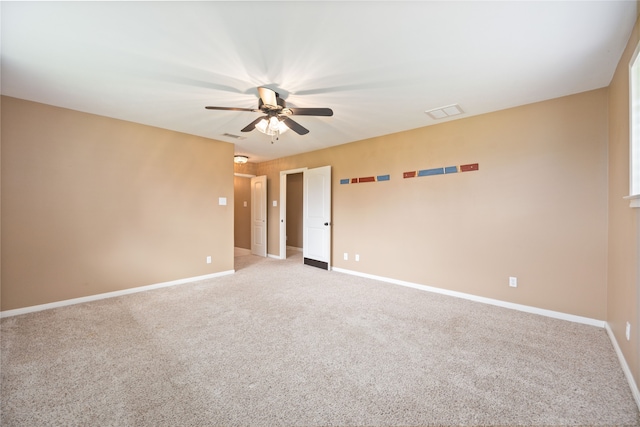 unfurnished room featuring light carpet and ceiling fan